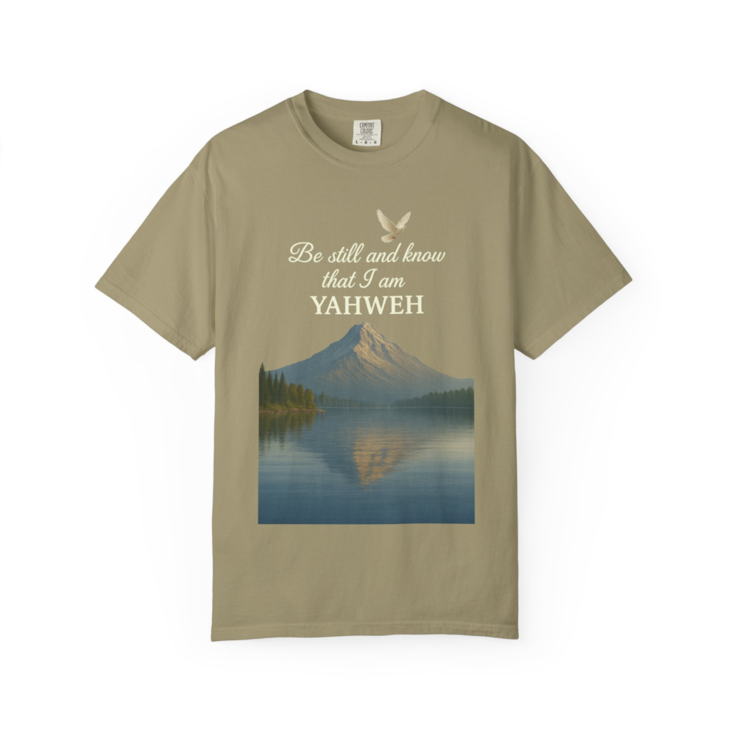 Be Still and Know That I Am Yahweh T-shirt with peaceful mountain lake, dove, and Psalm 46 Scripture artwork.